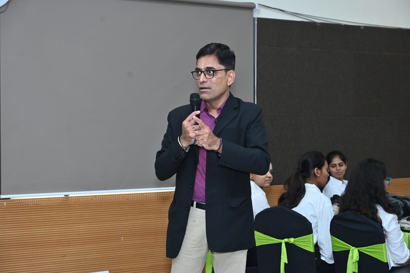 Srikanth Kalyanasundaram speaking to a postgraduate cohort